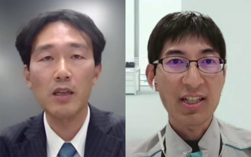 Split-screen video call: man on the left in a dark suit and blue tie speaks from a grey background; man on the right wears glasses and a light jacket with an earbud in a bright office.